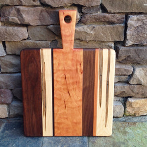 Beautiful cutting board with cherry, walnut and ambrosia maple wood by Michael's Woodcrafts Greenville SC