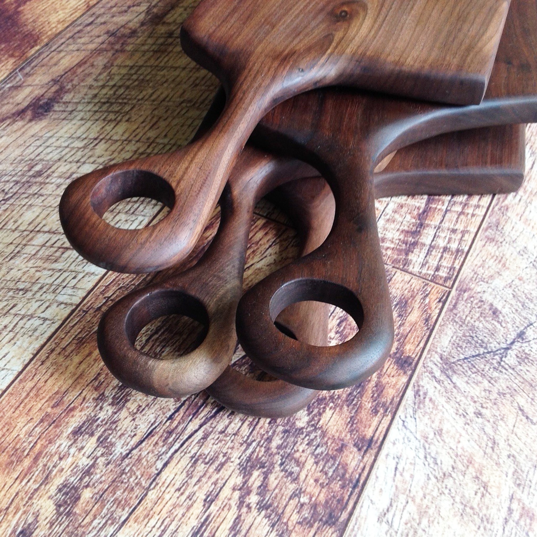 beautiful walnut charcuterie serving cutting board with hand carved handle by Michael's Woodcrafts