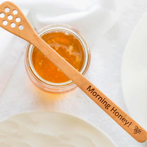 Cherry wood honey dipper stick engraved Morning Honey laying across the top of a honey jar  by Michael's Woodcrafts Greenville SC woodworkers woodworking
