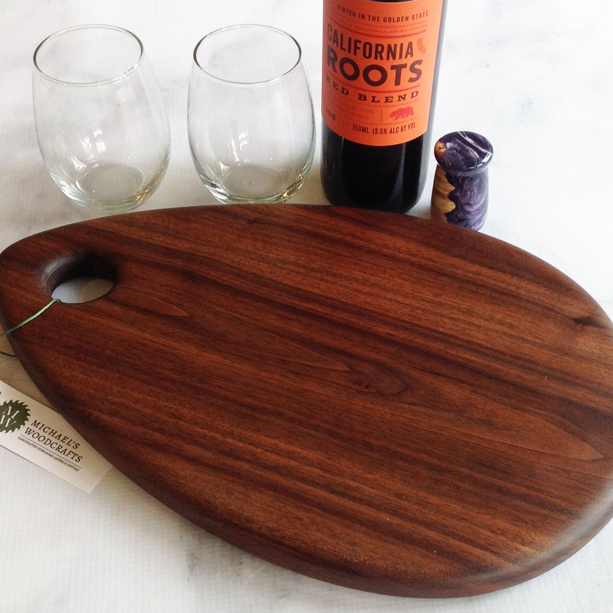 teardrop shaped walnut charcuterie boardby Michael's Woodcrafts Greenville SC woodworkers woodworking artist