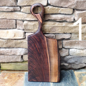 Beautiful crotch walnut charcuterie board with hand carved handle by Michael's Woodcrafts