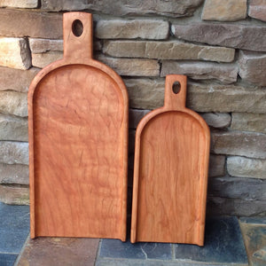 Two handcrafted cherry wood charcuterie serving boards by Michael's Woodcrafts