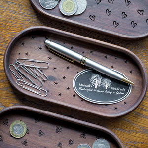 Beautiful walnut catchall tray with stars engraved on bottom with a pen, paperclips and coins storage  by Michael's Woodcrafts Greenville SC woodworker Woodworking artist woodworkers