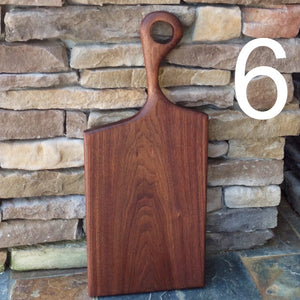 Beautiful American Walnut charcuterie cutting board with round hand carved handle by Michael's Woodcrafts Greenville SC